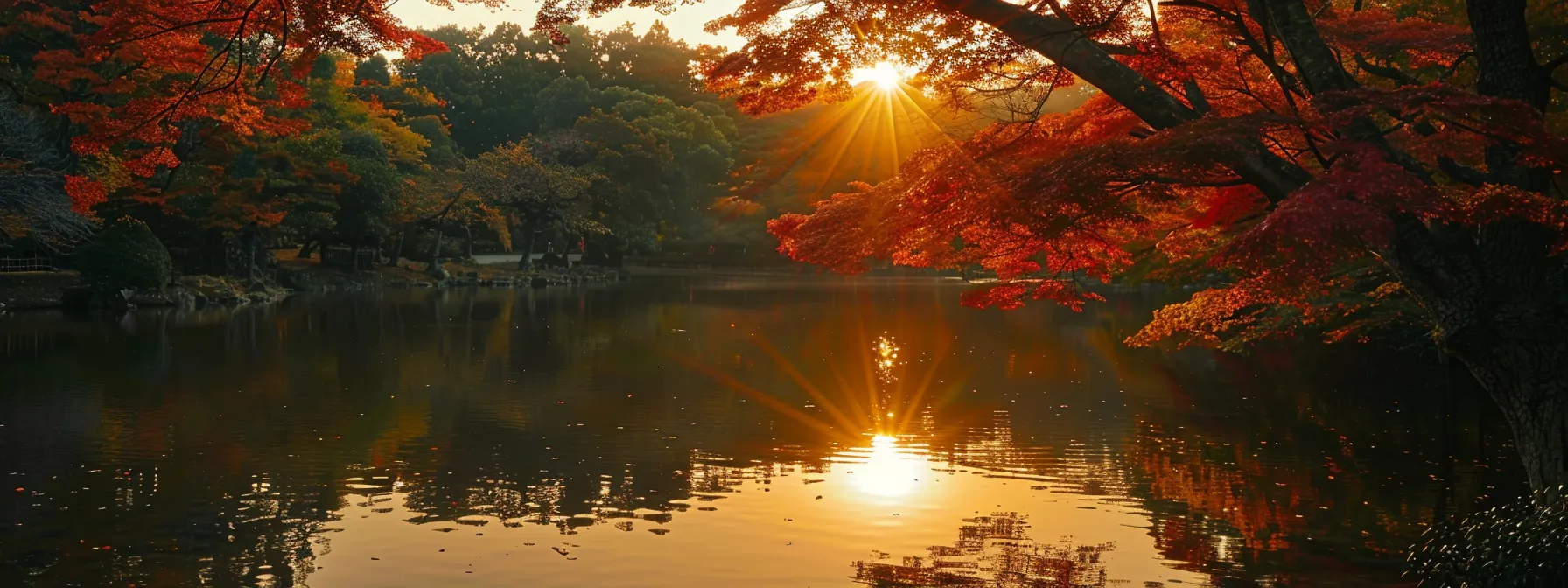 a serene sunset casts a golden glow over a tranquil lake, where vibrant autumn foliage reflects beautifully on the water's surface.