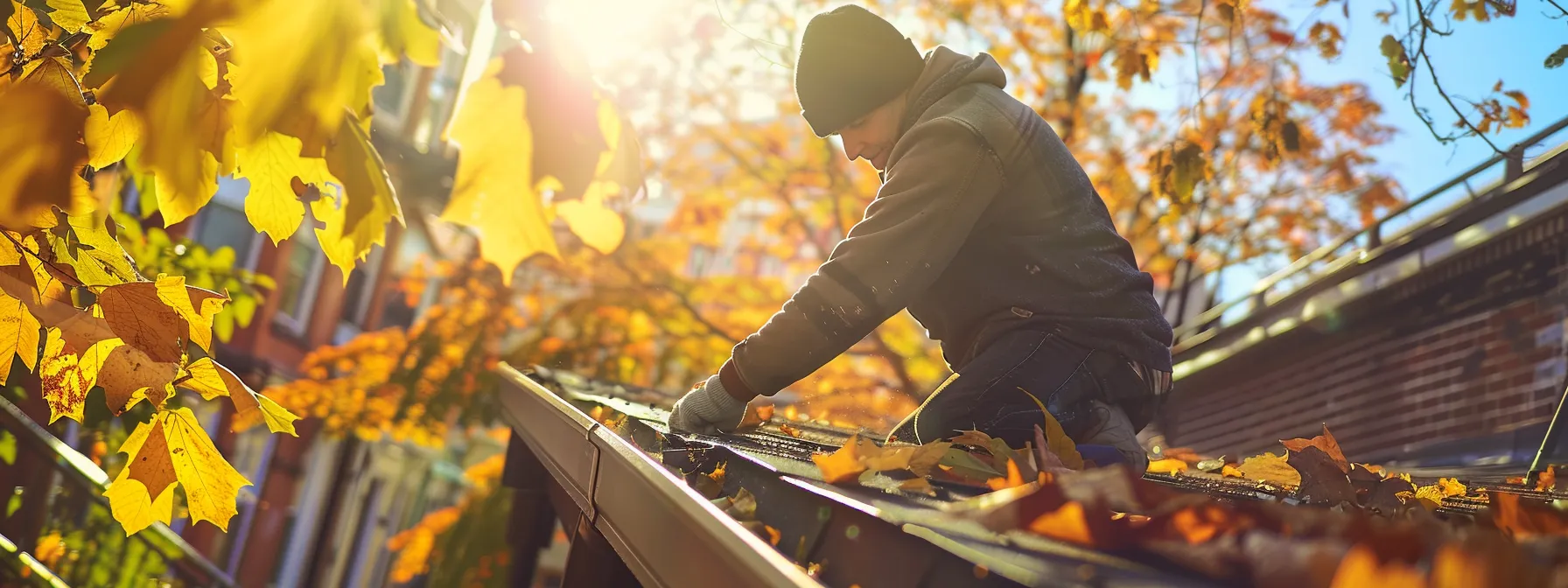 a skilled local expert efficiently repairing a gutter in a brooklyn neighborhood, showcasing vibrant foliage in the background under warm, natural sunlight. a skilled local expert efficiently repairing a gutter in a brooklyn neighborhood, showcasing vibrant foliage in the background under warm, natural sunlight.