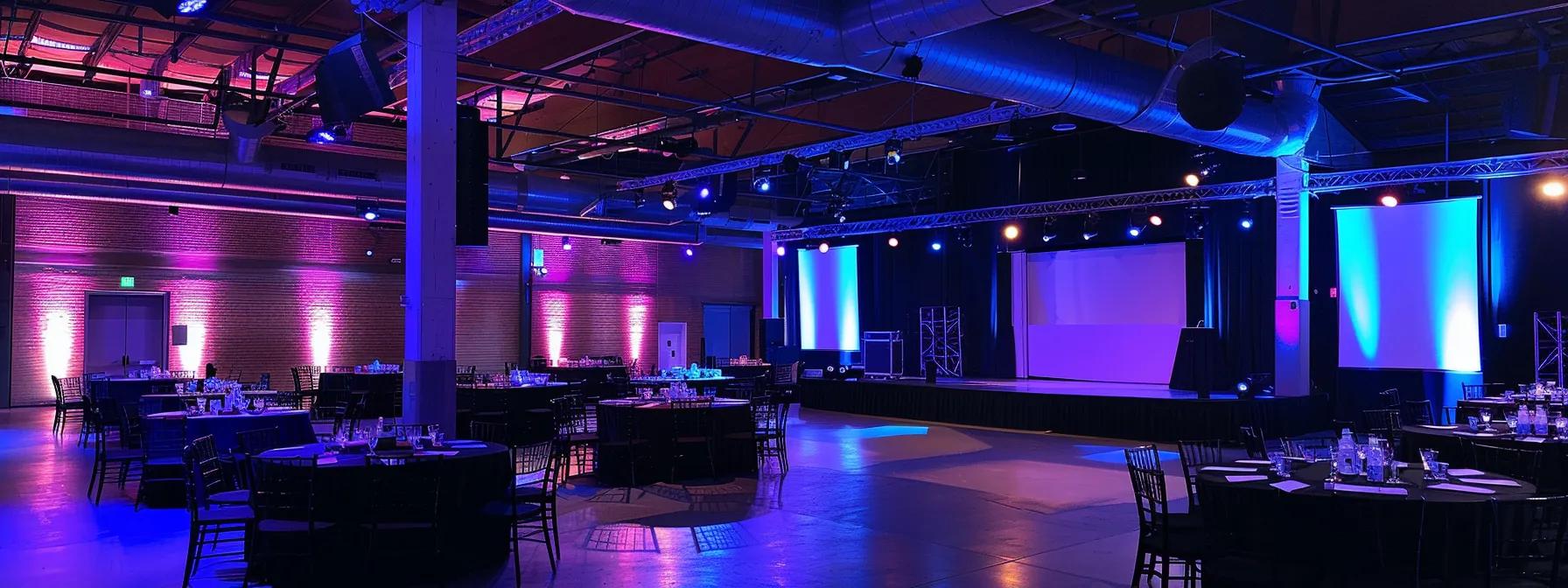 a sleek conference room in laval set up for an event, featuring modern audio-visual equipment and accessible seating arrangements, illuminated by adjustable overhead lighting that enhances the space's welcoming atmosphere.