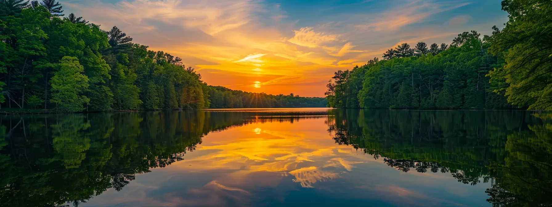 a vibrant sunset casts a warm golden hue over a tranquil lake surrounded by lush, emerald forests, reflecting the kaleidoscope of colors in the clear water. a vibrant sunset casts a warm golden hue over a tranquil lake surrounded by lush, emerald forests, reflecting the kaleidoscope of colors in the clear water.