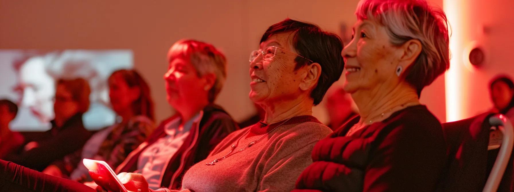 an engaging community health seminar in a modern wellness center showcases a diverse group of individuals actively participating in a red light therapy demonstration, highlighting their shared testimonials of pain management and recovery benefits in a warm, inviting indoor setting. an engaging community health seminar in a modern wellness center showcases a diverse group of individuals actively participating in a red light therapy demonstration, highlighting their shared testimonials of pain management and recovery benefits in a warm, inviting indoor setting.