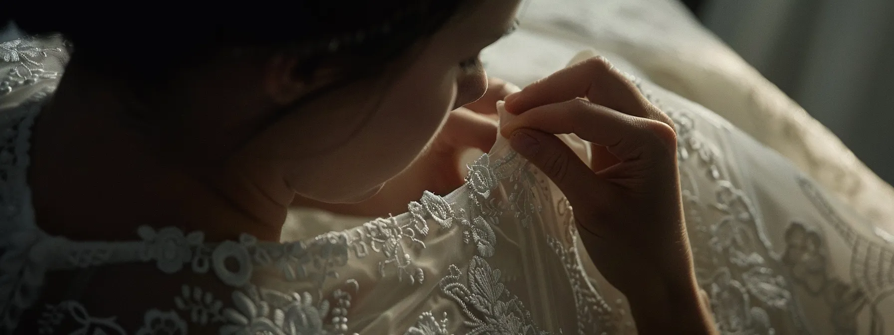 a seamstress carefully pinning the hem of a wedding dress with intricate lace details. a seamstress carefully pinning the hem of a wedding dress with intricate lace details.