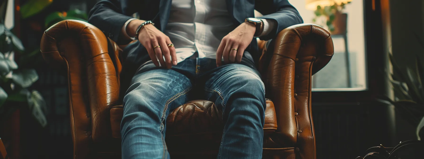 a stylish man effortlessly rocking stacked jeans with impeccable tailoring and trendy accessories. a stylish man effortlessly rocking stacked jeans with impeccable tailoring and trendy accessories.