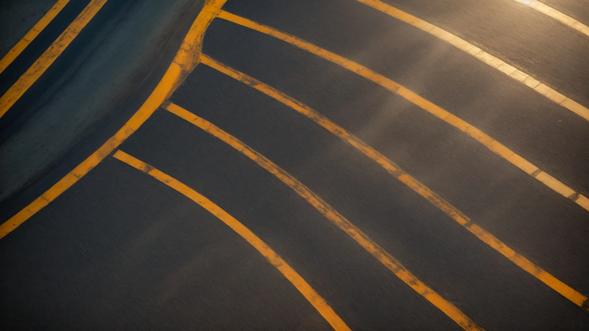 a vibrant aerial view of freshly sealed asphalt, showcasing smooth crack-free surfaces glistening under warm sunlight, symbolizing durability and the prevention of water damage.