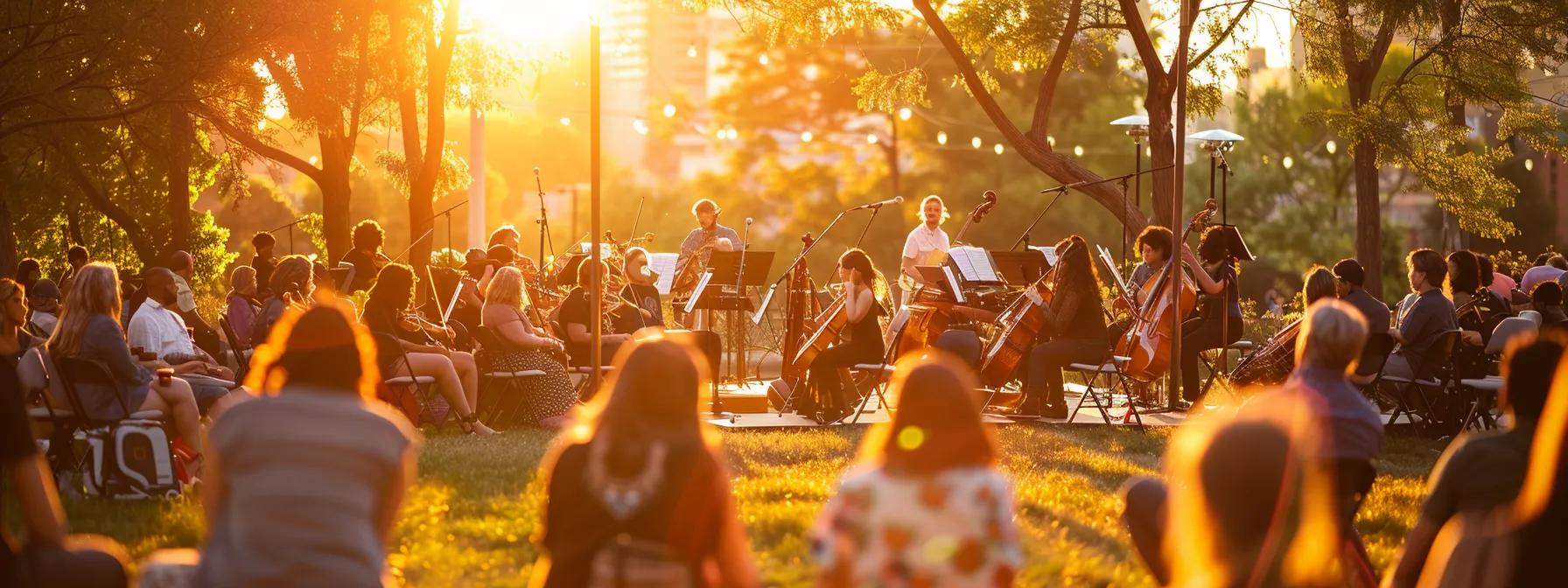 a vibrant outdoor performance by a local orchestra captivates a diverse audience, bathed in warm sunset light, as the music unites the community and celebrates cultural richness. a vibrant outdoor performance by a local orchestra captivates a diverse audience, bathed in warm sunset light, as the music unites the community and celebrates cultural richness.