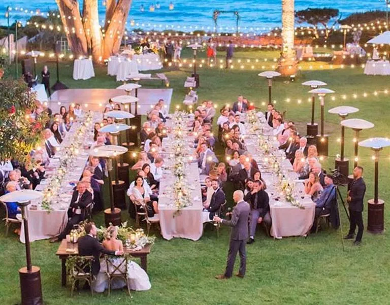 heaters placed to control climate at outdoor wedding