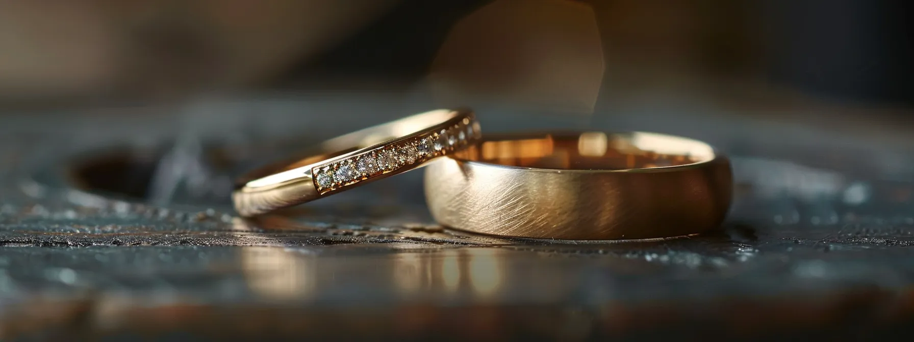 a close-up photo of a wedding band placed next to other rings on a hand, showcasing the importance of matching sizes for comfort and compatibility.