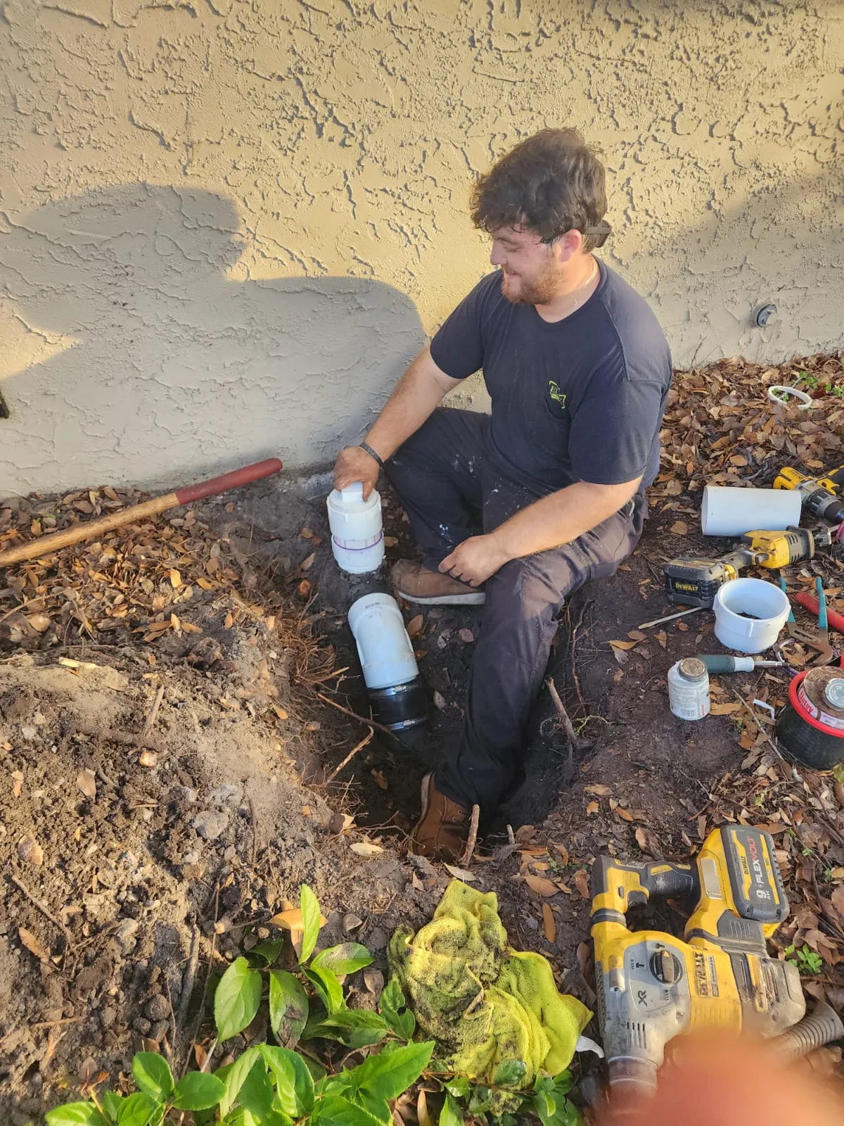 installing replacement sewer line