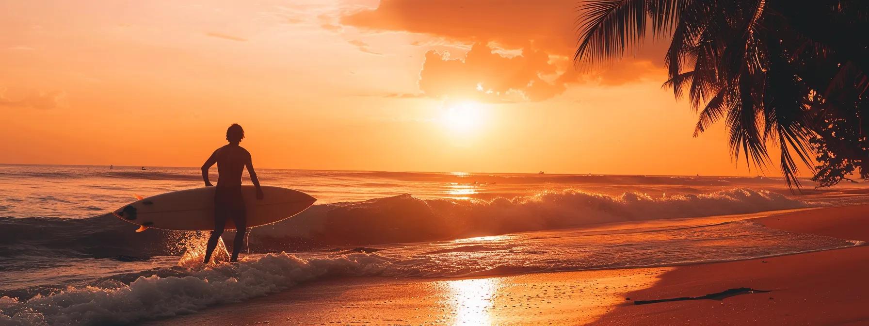 show a surfer silhuette against the sunset in a tropical beach