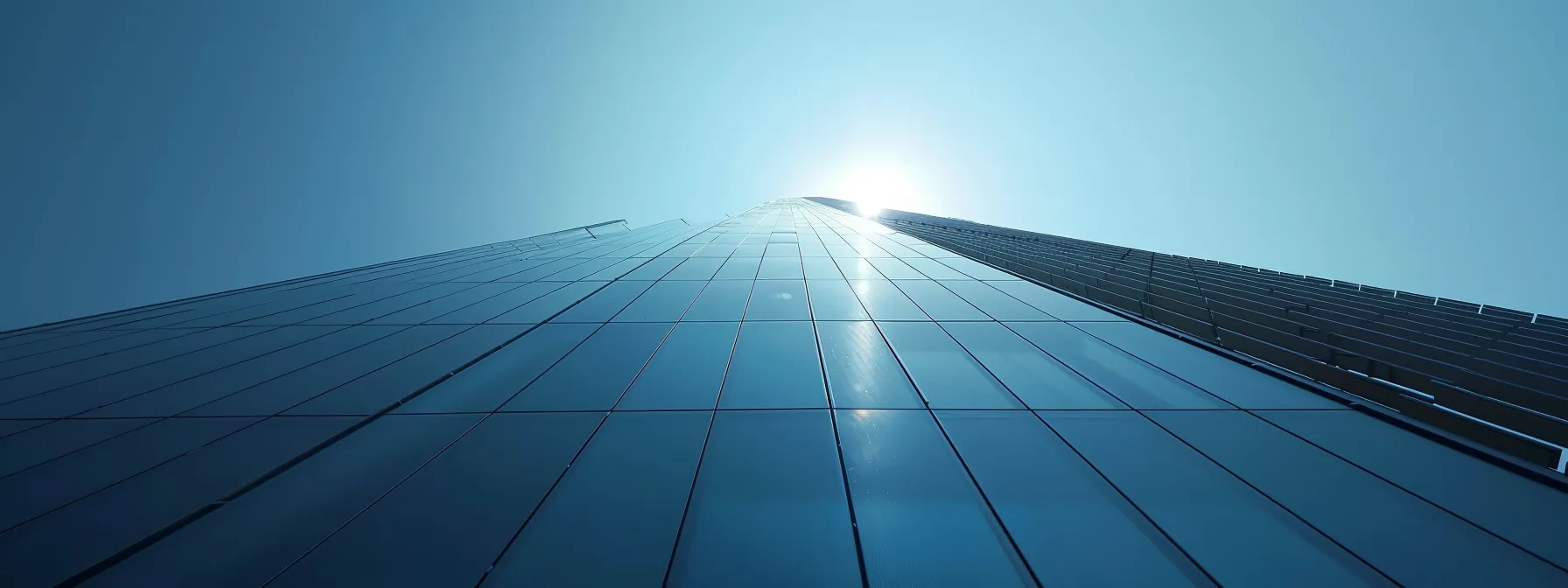 an array of sleek, modern solar panels glistening in the sunlight against a clear blue sky. an array of sleek, modern solar panels glistening in the sunlight against a clear blue sky.