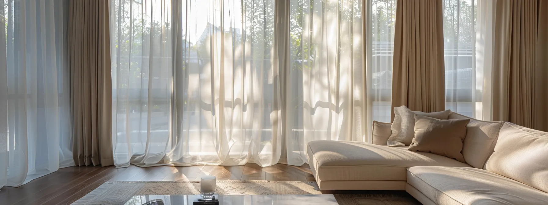 an elegantly styled living room features white sheer curtains gracefully draping over large windows, layered with rich, heavy drapes, creating a bright and inviting atmosphere that balances warmth and sophistication.