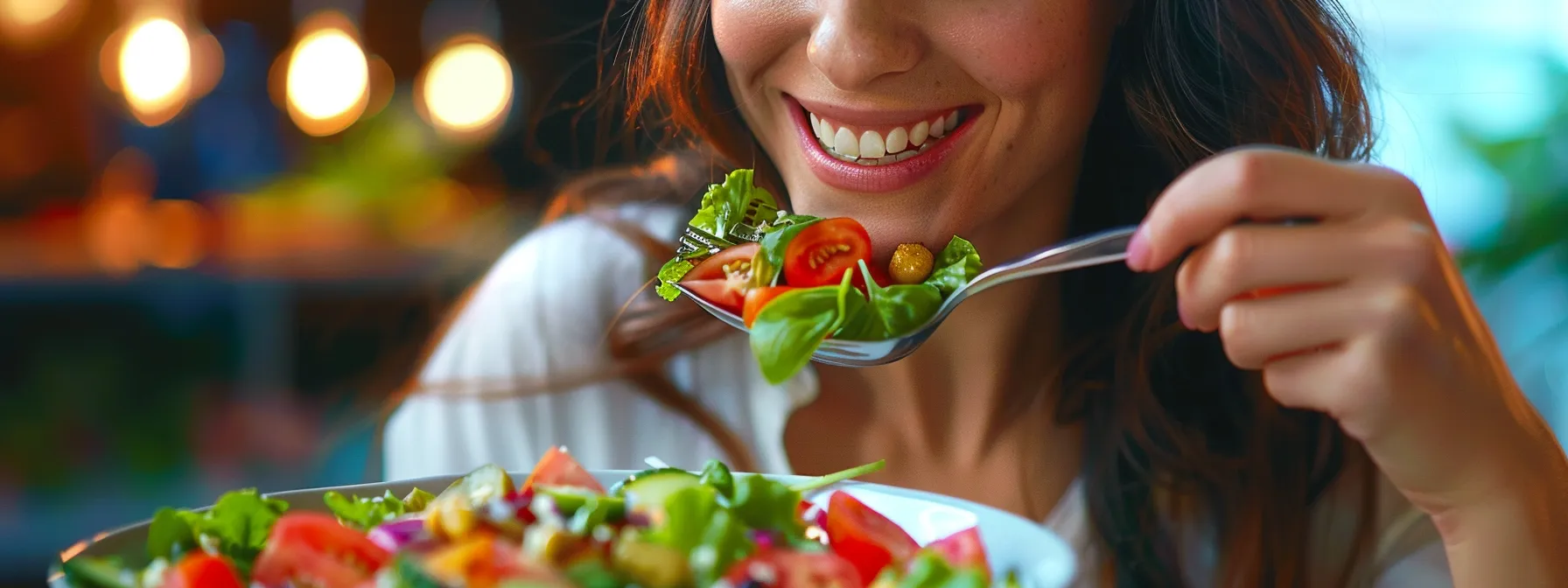 a person savoring a colorful, fresh salad with a smile on their face.