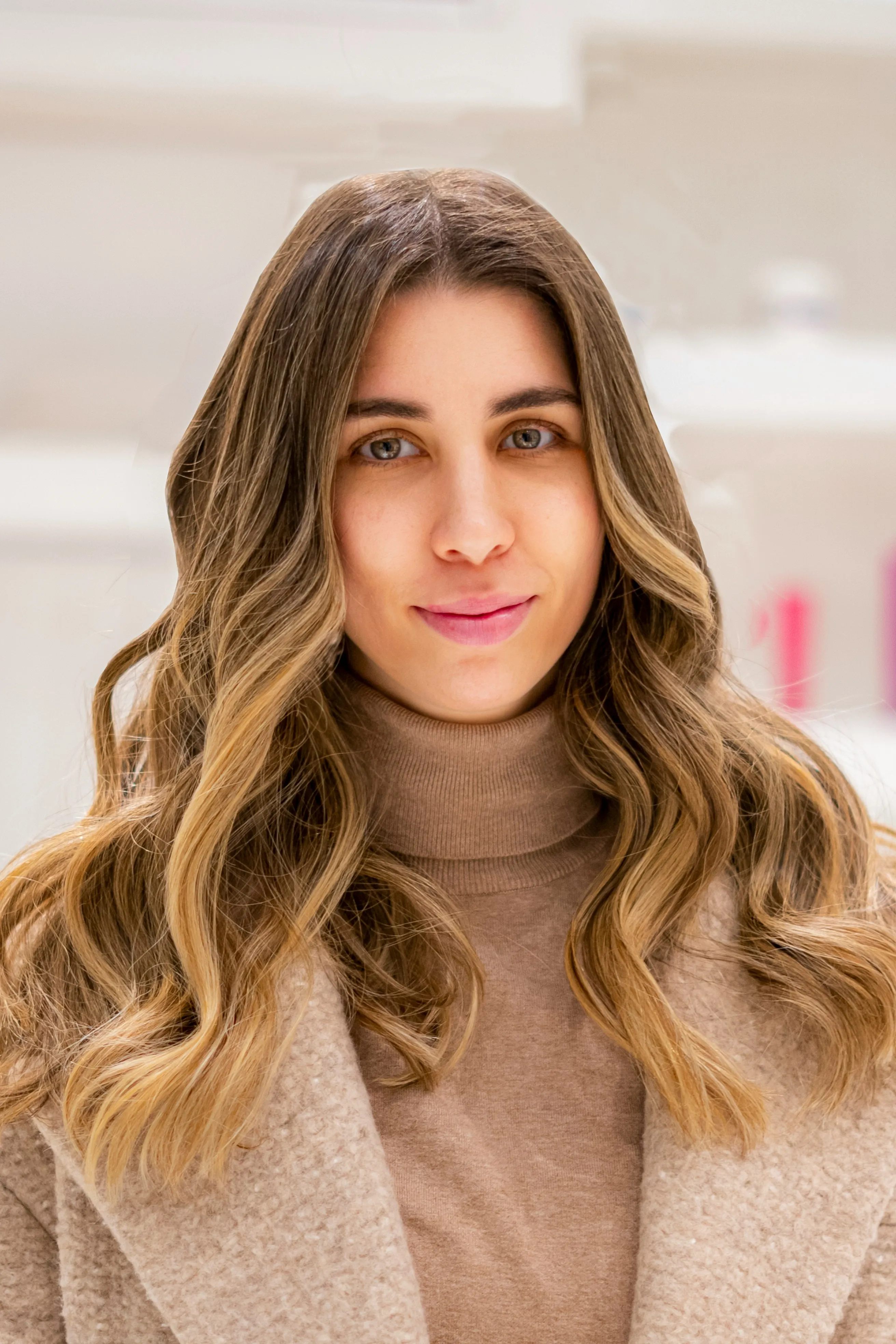client smiling for a picture with styled hair client smiling for a picture with styled hair