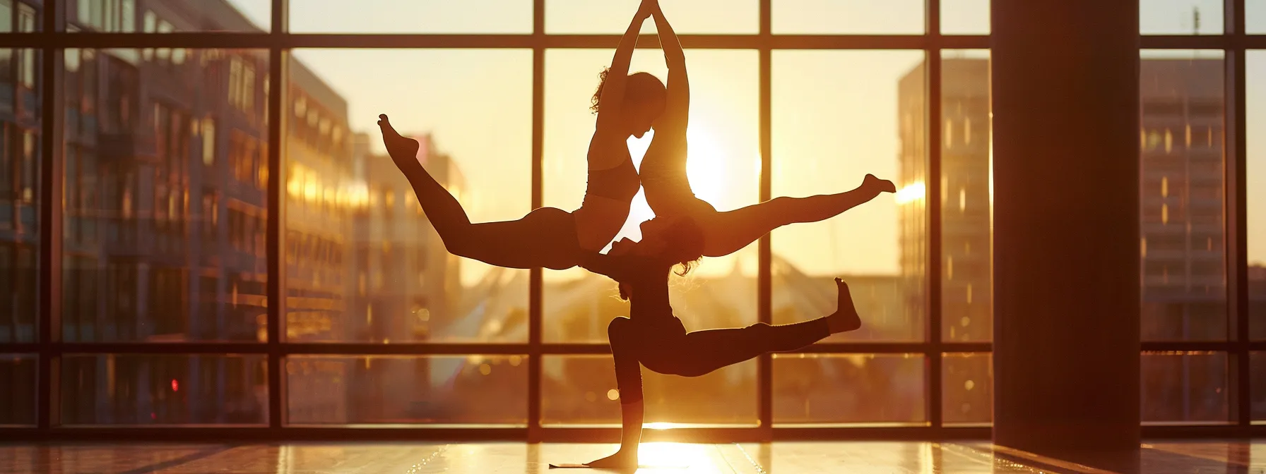 two people gracefully performing acro-yoga poses in perfect synchrony.