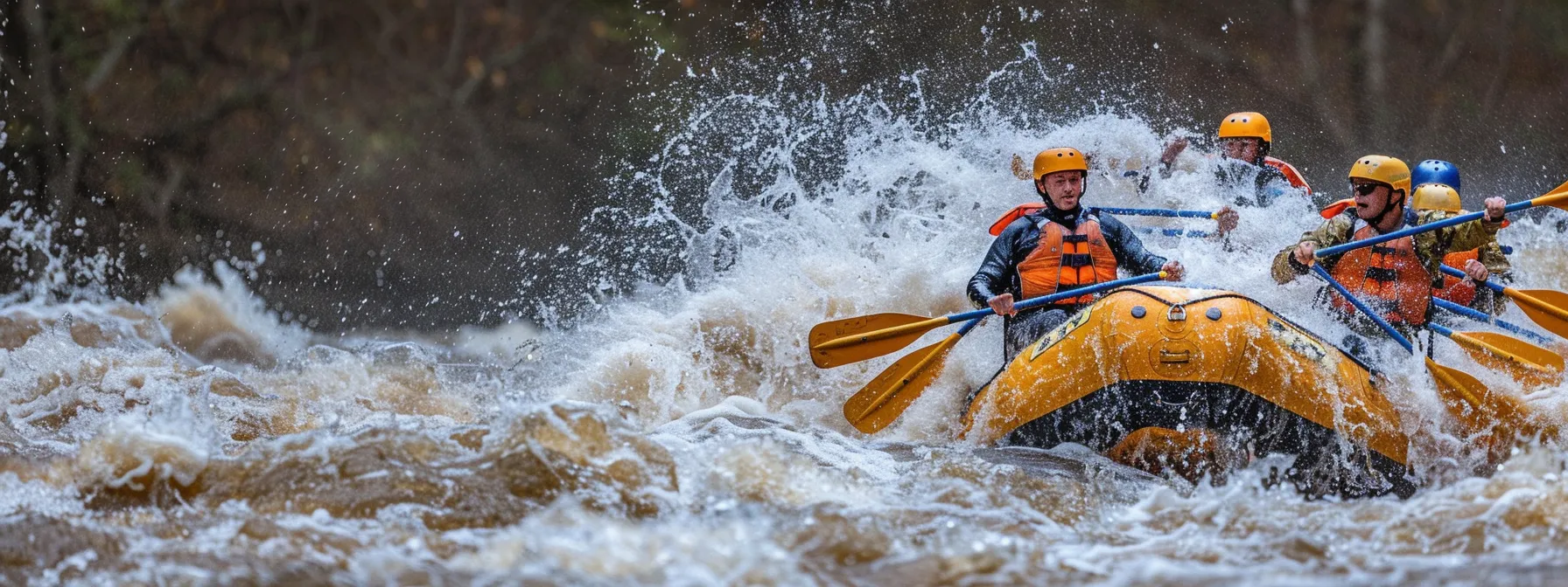 a group of rafters navigating through class four rapids on the ocoee river.