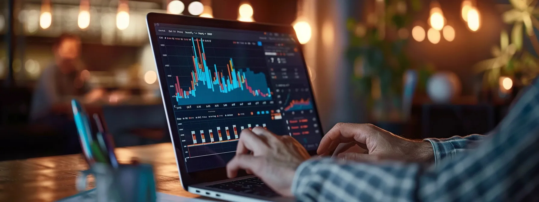 a person auditing a website's performance on a laptop, with graphs and data displayed on the screen.