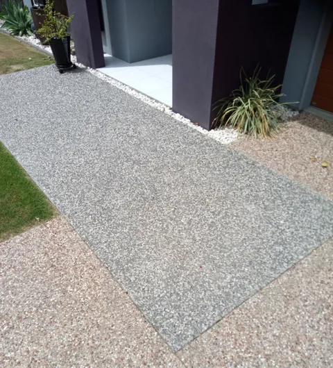 Concrete being poured for an exposed aggregate finish