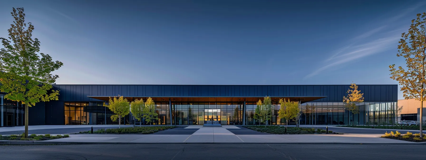 an elegantly designed modern building showcases striking architectural symmetry, with its symmetrical façade reflecting the interplay of light and shadow, highlighting the balance and aesthetic appeal central to contemporary design. an elegantly designed modern building showcases striking architectural symmetry, with its symmetrical façade reflecting the interplay of light and shadow, highlighting the balance and aesthetic appeal central to contemporary design.