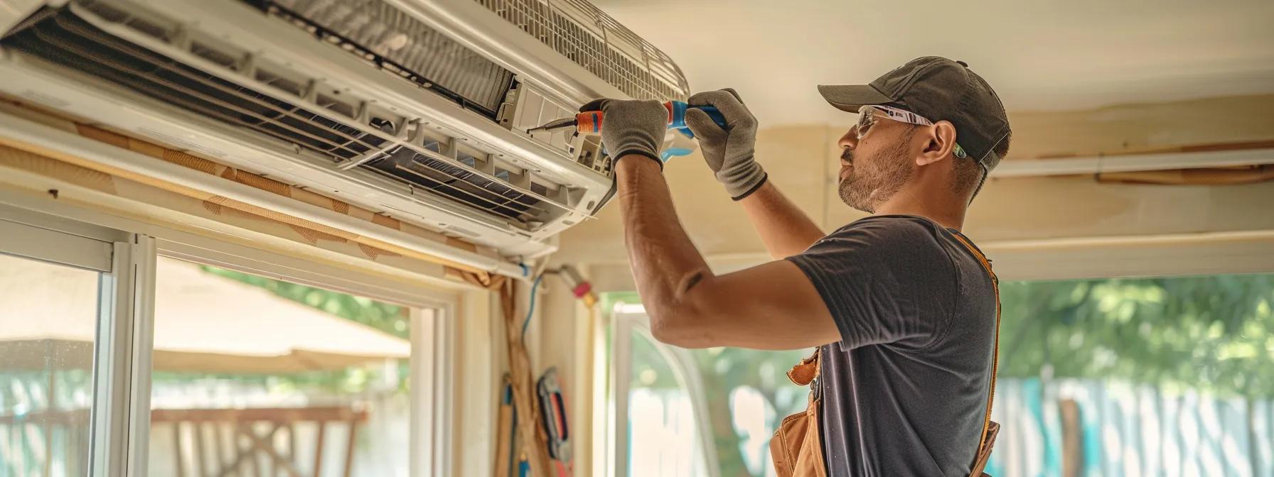 person installing mini split homeowner standing by