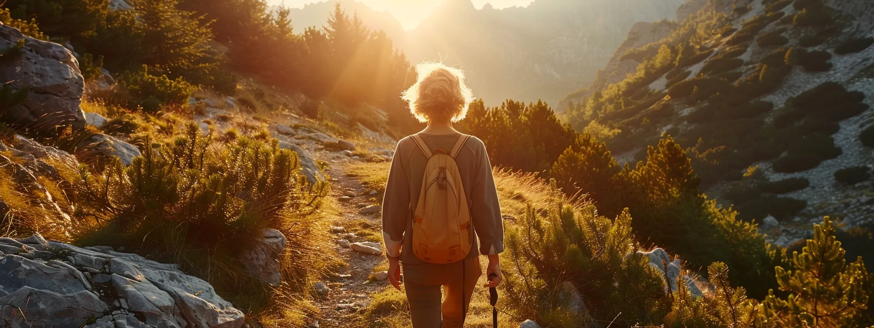 healthy older woman walking in the mountains