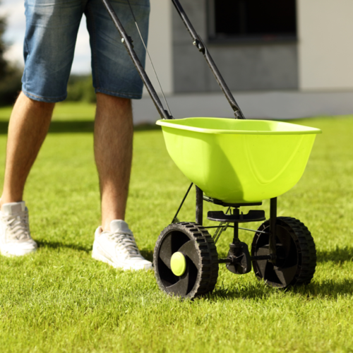 Man Pushing Spreader