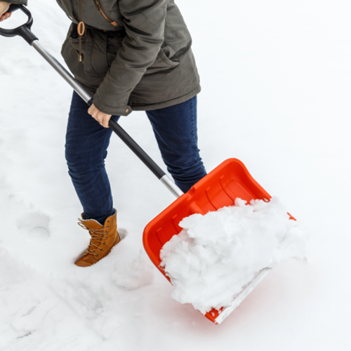 Woman Shoveling Snow