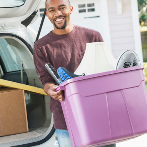 Man Unpacking Car