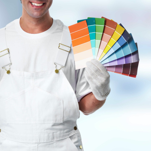 Man Holding Fan of Paint Swatches