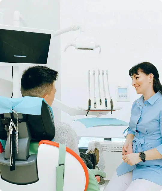 A patient brushing their teeth, illustrating the importance of supplementing home care with routine professional dental exams at Issa Dental Group.