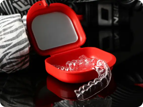 A patient easily inserting custom-made, virtually invisible Invisalign clear aligners at Issa Dental for comfortable teeth straightening.