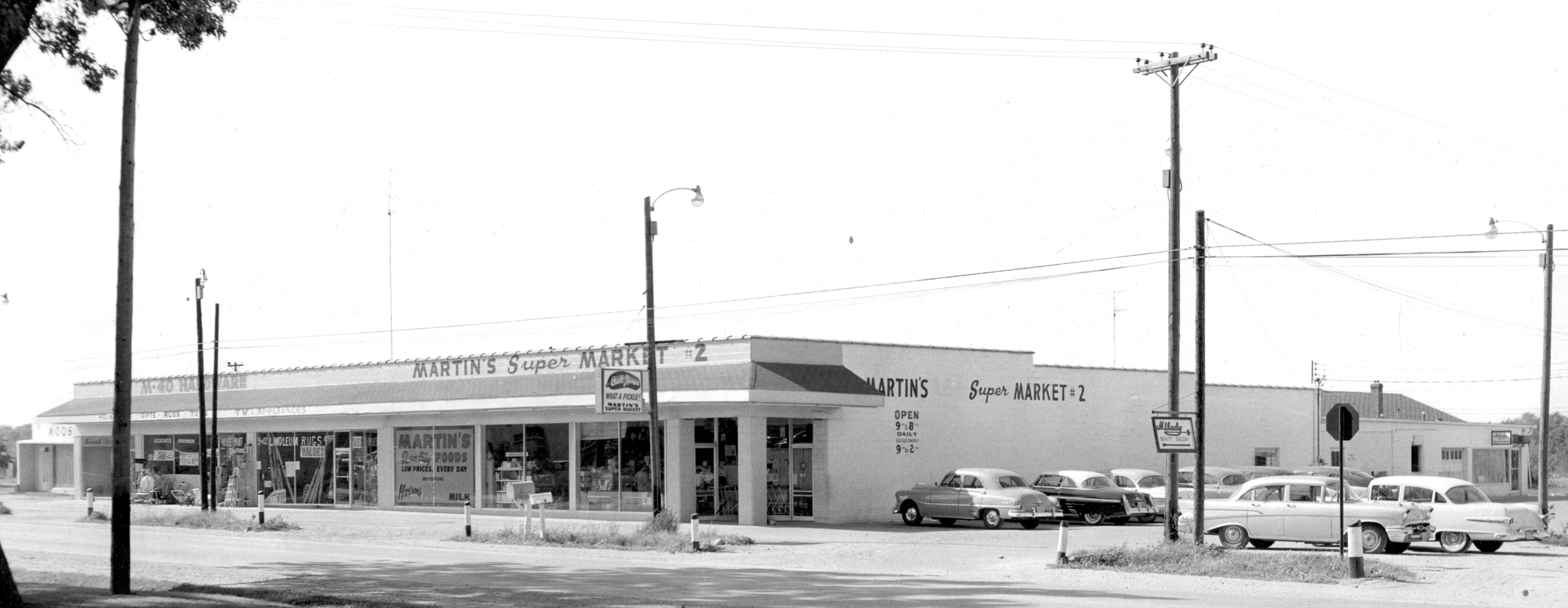 Our Building in 1958.  Martins Grocery Store, an appliance store, a beauty salon and M 40 Hardware