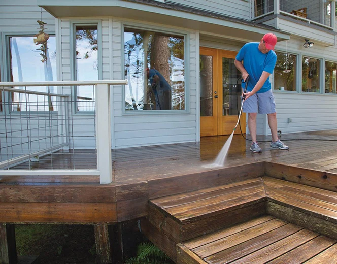 Pressure washing a wooden deck