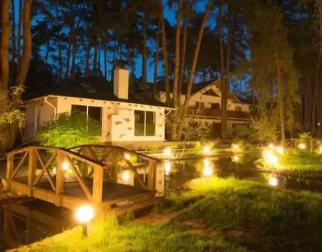 Home with outdoor lighting at night