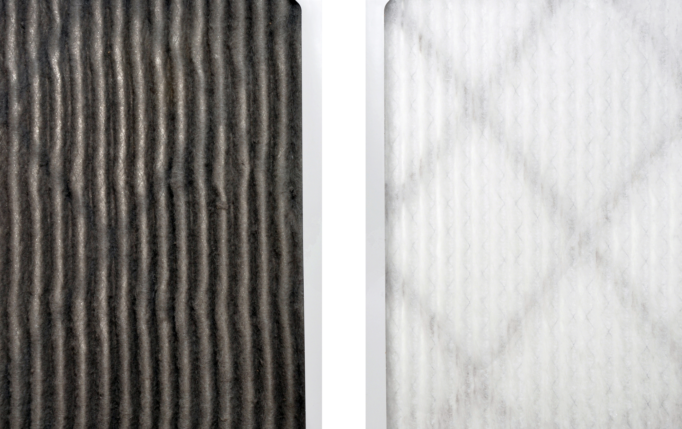A dirty air filter beside a clean air filter