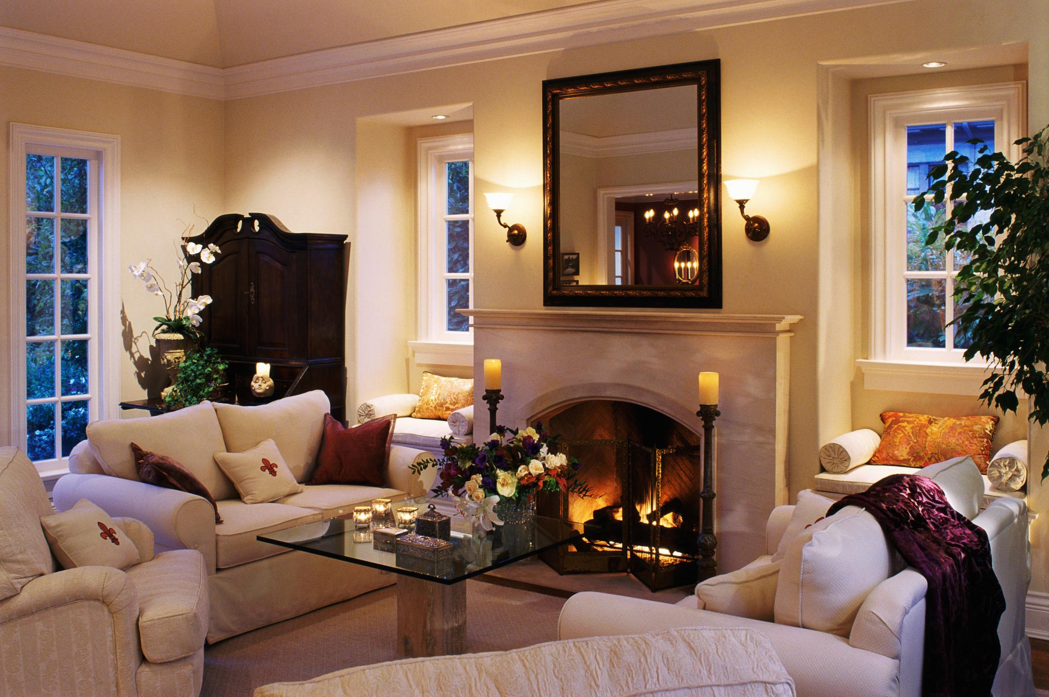 Living room with a lit fireplace on a winter evening