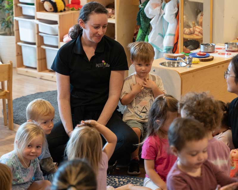 Educators from Petit ELJ sit in an indoor space listening to the children's stories, interests and ideas. Observing children grow and develop is a fulfilling and rewarding career and at Petit ELJ we value every team member, their success stories and the incredible roles they play.