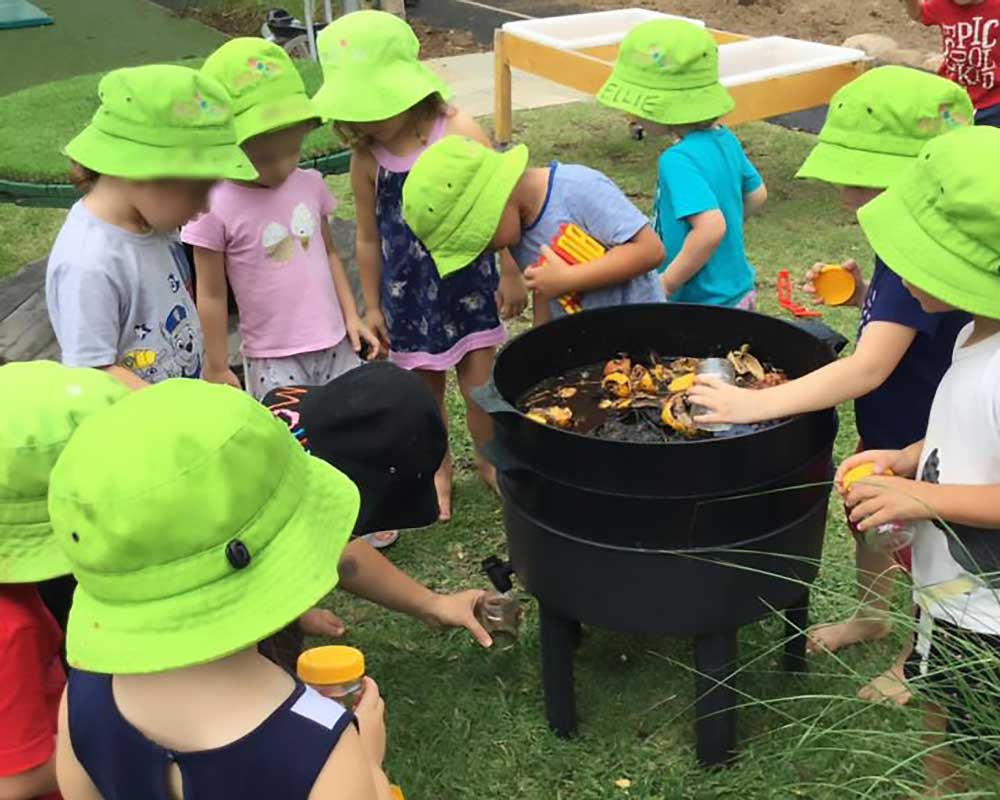 Children add left overs to two-level earthworm farm set-up and farm it for its worm wee.