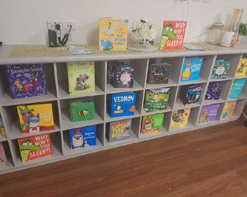 Book shelves featuring Australian picture books for children such as Tippy Jellybean are read by our educators. 