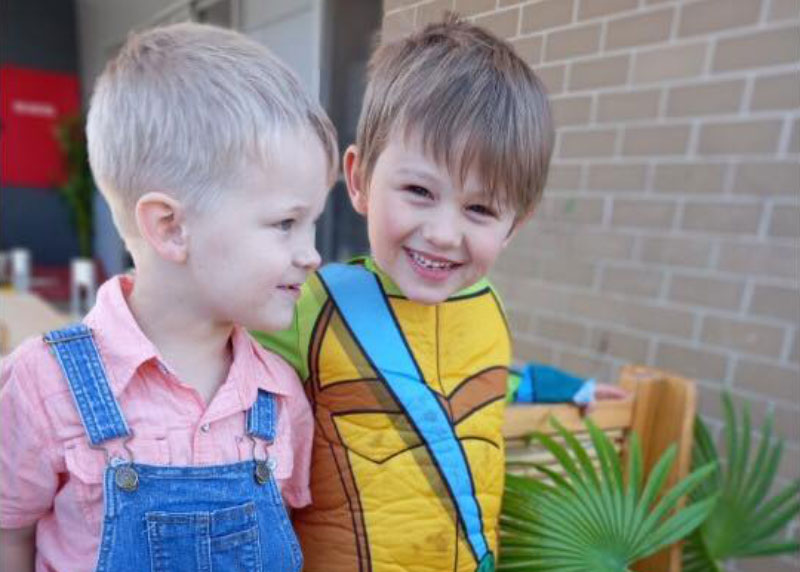 Two children participate in a childcare experience together demonstrating their ability to choose their friends, an article from the United Conventions of the Rights of a Child.