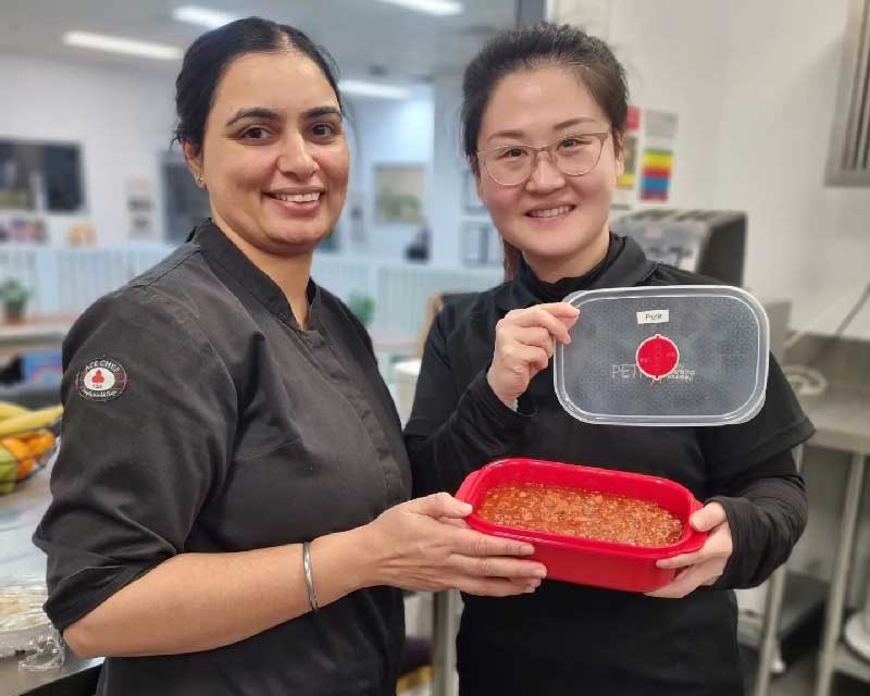 Chef Sandeep prepares one of her best recipes for an educator's take home meal at Petit ELJ Forest Hill.