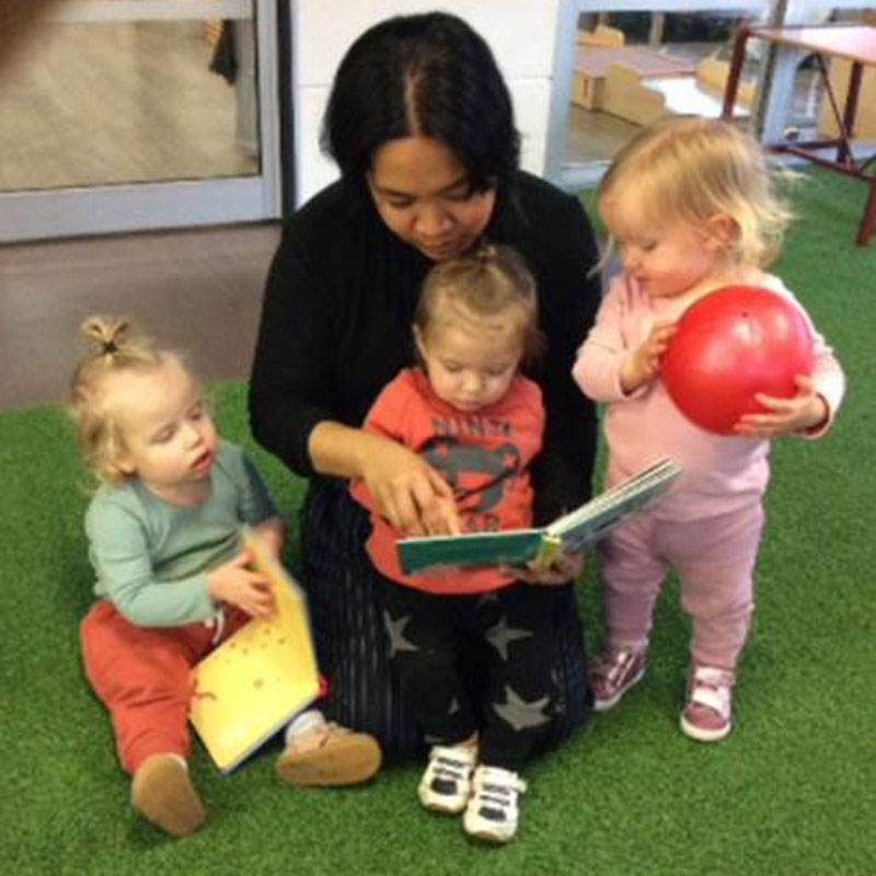 Children gather around for “circle time”. – Using contemporary theories to provide innovation in early childhood learning.
