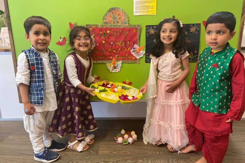 Children in traditional dress for Diwali embracing culturally diverse experiences.