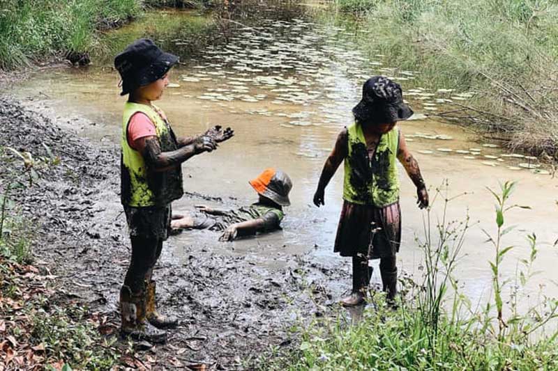 Children playing and learning about the environment. Bush Kindy is one tool for teaching sustainability in early childhood