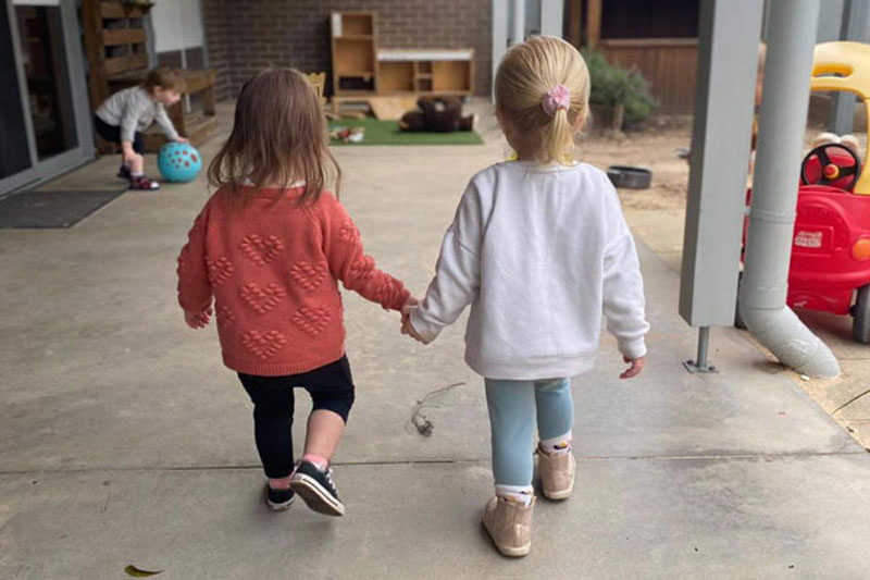 Two children learning to share their space and time.