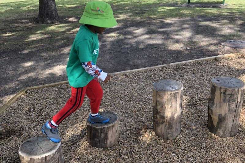 A Petit ELJ child takes part in a nature play park adventure.