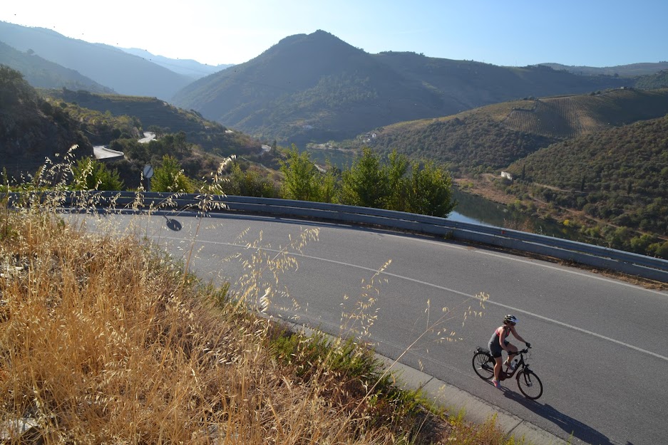 The Best Cycling Routes in Portugal, from the Coast to the Mountains - Lone cyclist on a traffic free road in the Douro Valley in northern Portugal