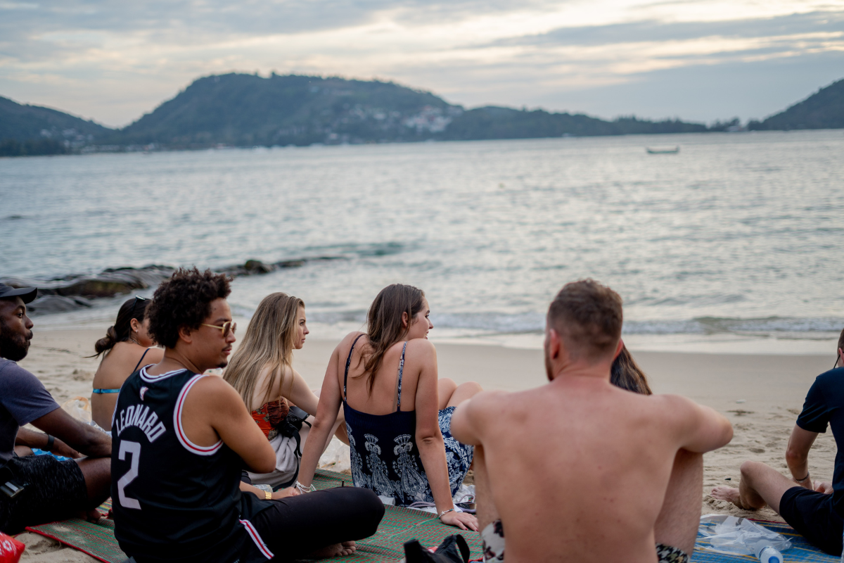 people hanging out at kalim beach