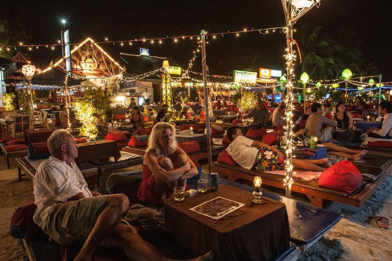 people chilling at chaweng beach night market at night