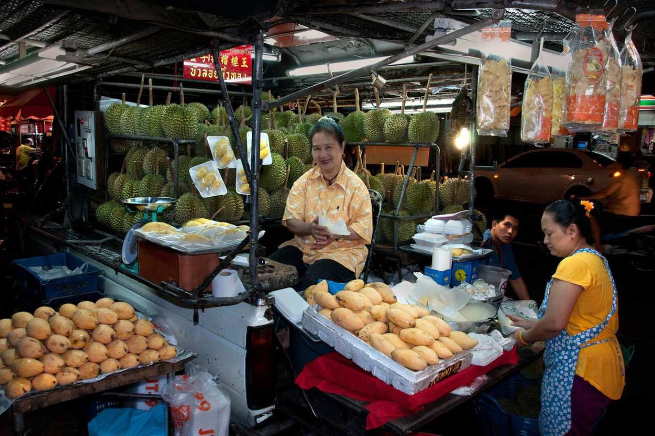 food stall selling mangos and durian at the night market