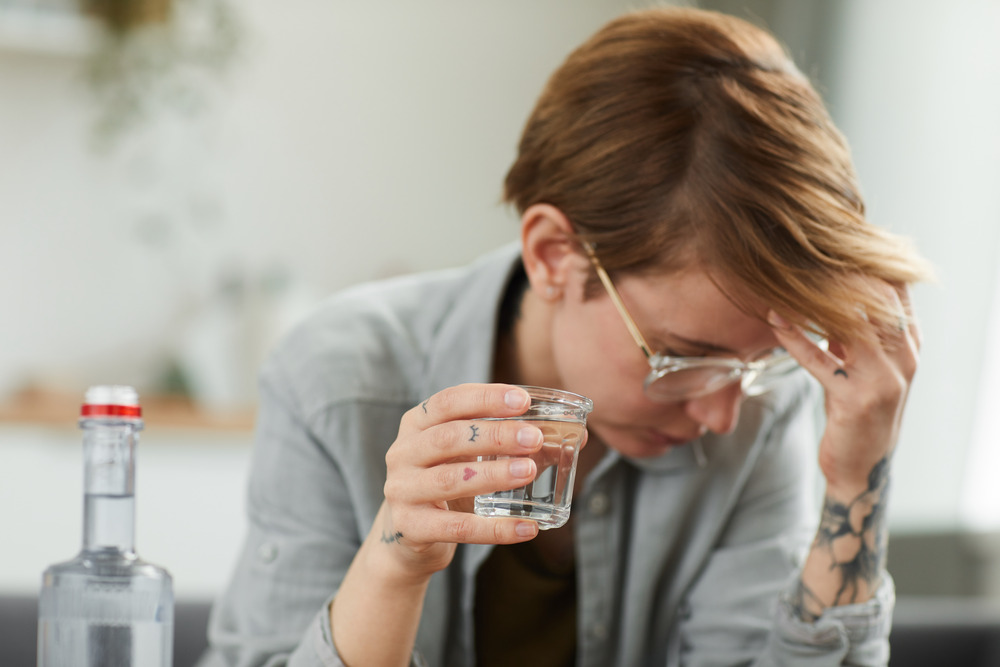 woman struggling with alcohol abuse and vision problems